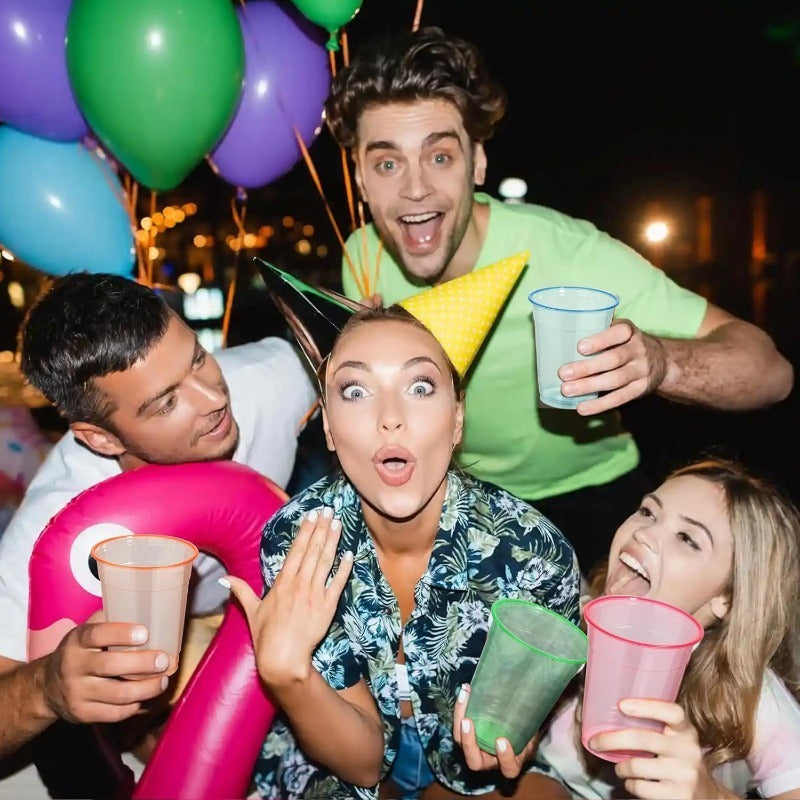 Neon Party Cups, 100-Pack Disposable Plastic Drink Cups in 12 or 16 oz Sizes for Blacklight Glow Parties, Birthdays, Halloween and Holiday Celebrations