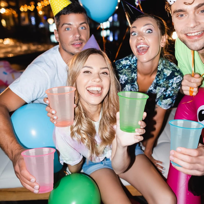 Neon Party Cups, 100-Pack Disposable Plastic Drink Cups in 12 or 16 oz Sizes for Blacklight Glow Parties, Birthdays, Halloween and Holiday Celebrations